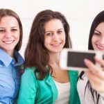 Three girls with camera